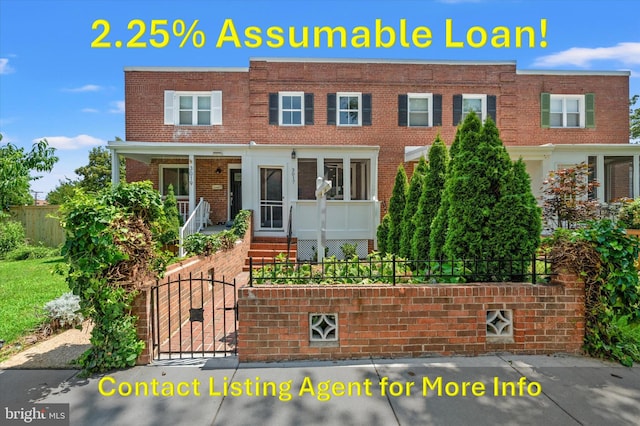 3017 Fulton St, Alexandria, VA 22305 - multi unit property with a fenced front yard, brick siding, a porch, and a gate