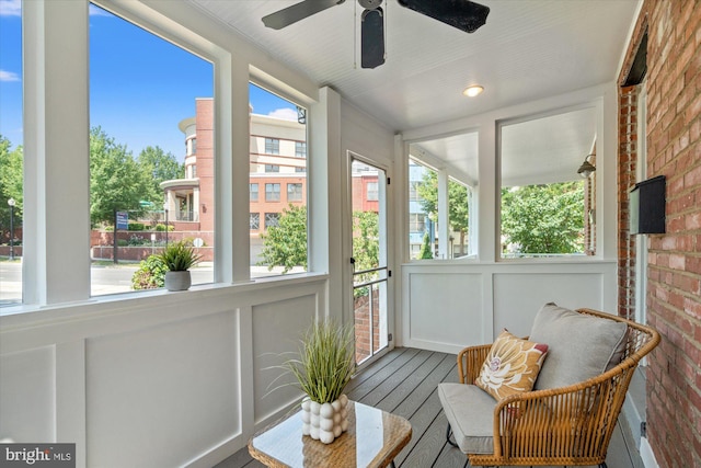 3017 Fulton St, Alexandria, VA 22305 - sunroom with ceiling fan, wood finished floors, and brick wall
