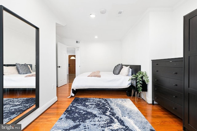 2920 Weisman Rd, Silver Spring, MD 20902 - bedroom with crown molding, light wood-style flooring, recessed lighting, and baseboards