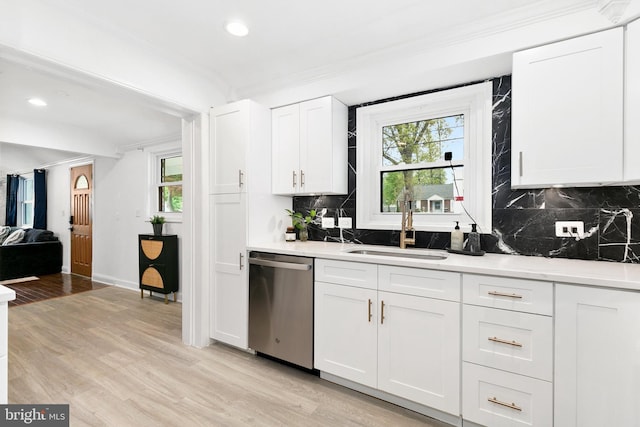 2920 Weisman Rd, Silver Spring, MD 20902 - kitchen with dishwasher, a sink, ornamental molding, light wood-type flooring, and plenty of natural light