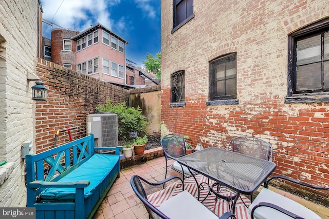 1502 13th St NW Unit 1, Washington, DC 20005 - view of patio featuring central AC and outdoor dining area