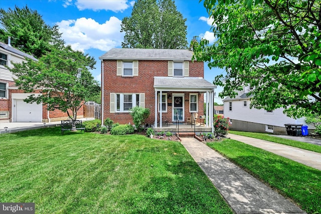 619 Warwick Rd, Baltimore, MD 21229 - view of front of home featuring a porch, a front lawn, and brick siding