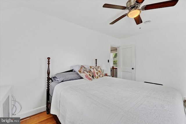 619 Warwick Rd, Baltimore, MD 21229 - bedroom with wood finished floors, baseboards, and ceiling fan