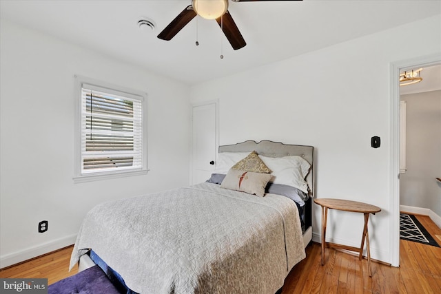 619 Warwick Rd, Baltimore, MD 21229 - bedroom featuring baseboards, wood finished floors, and a ceiling fan