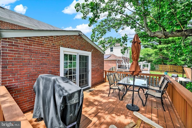 619 Warwick Rd, Baltimore, MD 21229 - wooden terrace featuring outdoor dining space and a grill