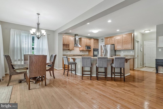 141 Lorins Dr, Huntingtown, MD 20639 - dining space featuring light wood-style floors, a chandelier, baseboards, and recessed lighting