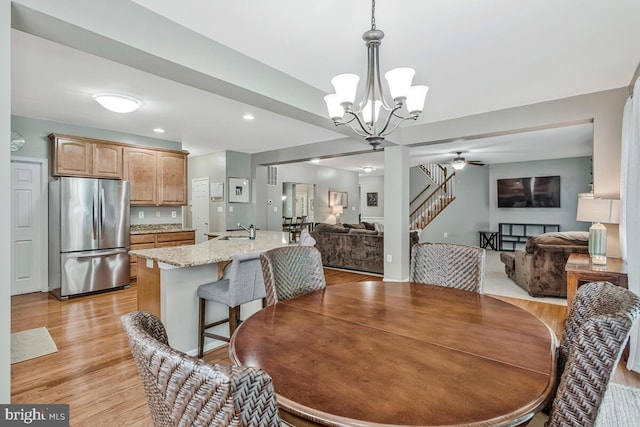 141 Lorins Dr, Huntingtown, MD 20639 - dining space featuring a chandelier, light wood-style flooring, stairs, ceiling fan, and recessed lighting