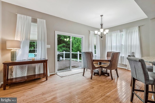 141 Lorins Dr, Huntingtown, MD 20639 - dining area featuring a chandelier, light wood finished floors, and baseboards