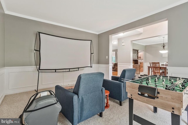 141 Lorins Dr, Huntingtown, MD 20639 - home theater with a wainscoted wall, crown molding, carpet flooring, and a decorative wall