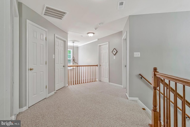 141 Lorins Dr, Huntingtown, MD 20639 - hall featuring an upstairs landing, carpet floors, and baseboards