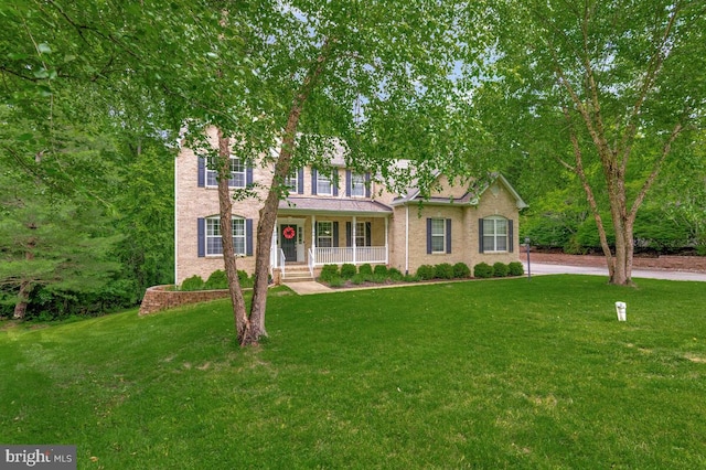 141 Lorins Dr, Huntingtown, MD 20639 - colonial home with a porch and a front yard