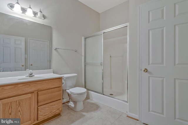 141 Lorins Dr, Huntingtown, MD 20639 - bathroom featuring a shower stall, toilet, vanity, and tile patterned flooring