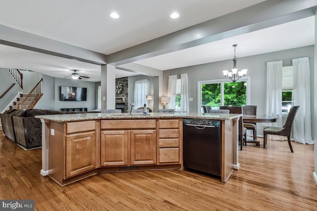 141 Lorins Dr, Huntingtown, MD 20639 - kitchen with black dishwasher, open floor plan, light wood-type flooring, light stone counters, and a chandelier