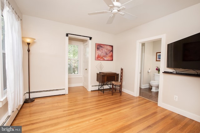 8 S Main St, Stockton, NJ 08559 - bedroom with a baseboard radiator, light wood-style floors, baseboards, and ensuite bath