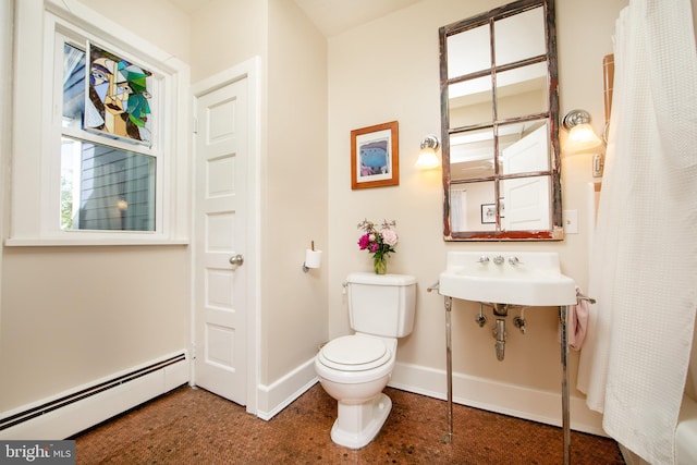 8 S Main St, Stockton, NJ 08559 - bathroom featuring baseboard heating, toilet, a sink, and baseboards