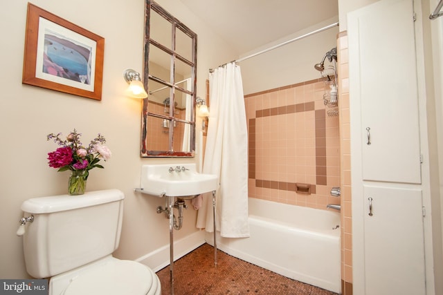 8 S Main St, Stockton, NJ 08559 - bathroom featuring toilet, shower / bath combination with curtain, a sink, and baseboards