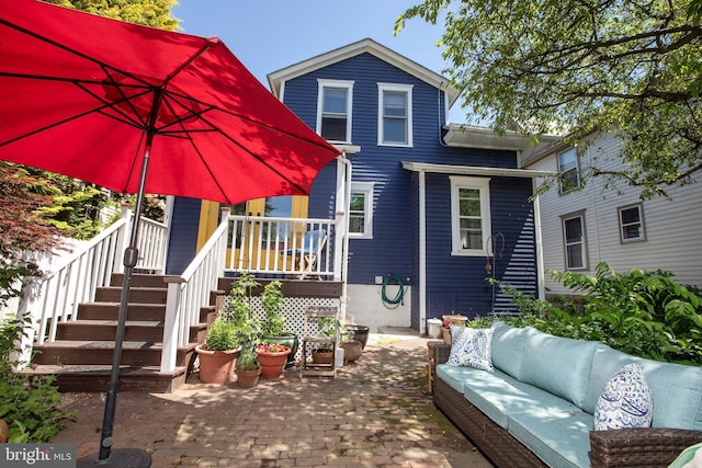 8 S Main St, Stockton, NJ 08559 - back of property with an outdoor living space, a patio area, and stairs