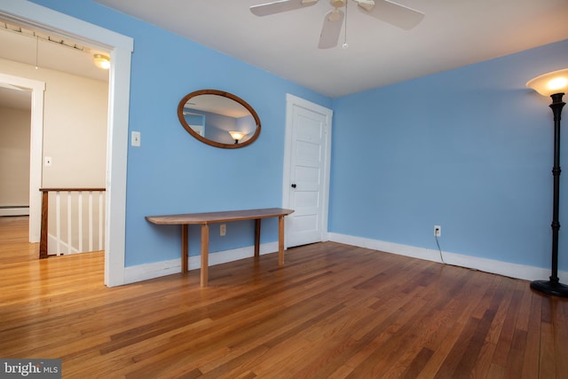 8 S Main St, Stockton, NJ 08559 - unfurnished room with wood finished floors, ceiling fan, and baseboards