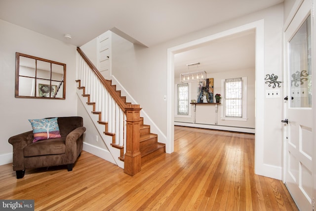 8 S Main St, Stockton, NJ 08559 - foyer entrance with a baseboard radiator, light wood-style flooring, stairway, and baseboards