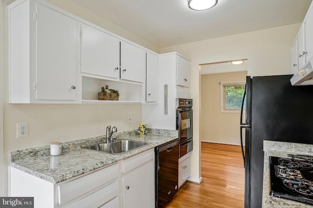 8230 Citadel Pl, Vienna, VA 22180 - kitchen featuring black appliances, a sink, light wood-style floors, white cabinets, and a warming drawer