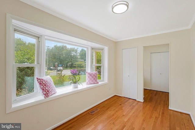 8230 Citadel Pl, Vienna, VA 22180 - unfurnished room featuring crown molding, plenty of natural light, light wood finished floors, and baseboards