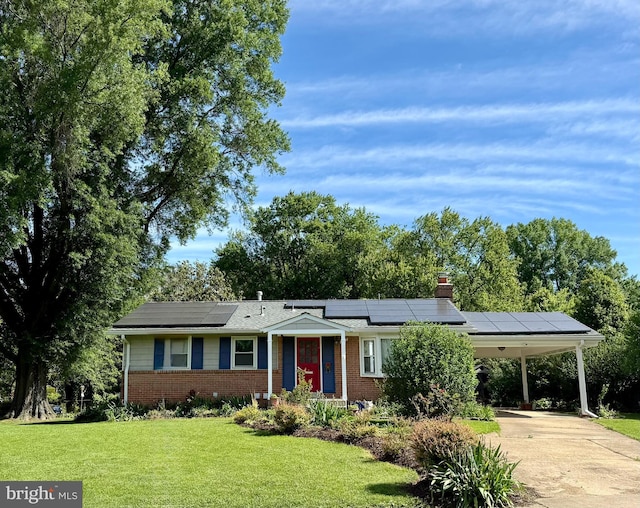 8230 Citadel Pl, Vienna, VA 22180 - ranch-style home with brick siding, a front yard, driveway, solar panels, and an attached carport