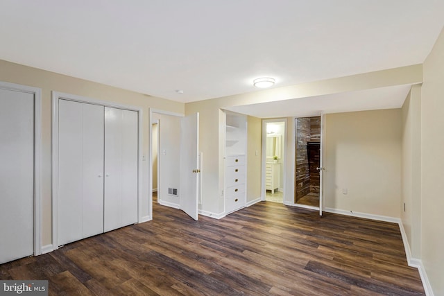 8230 Citadel Pl, Vienna, VA 22180 - unfurnished bedroom featuring dark wood-type flooring, baseboards, and ensuite bath