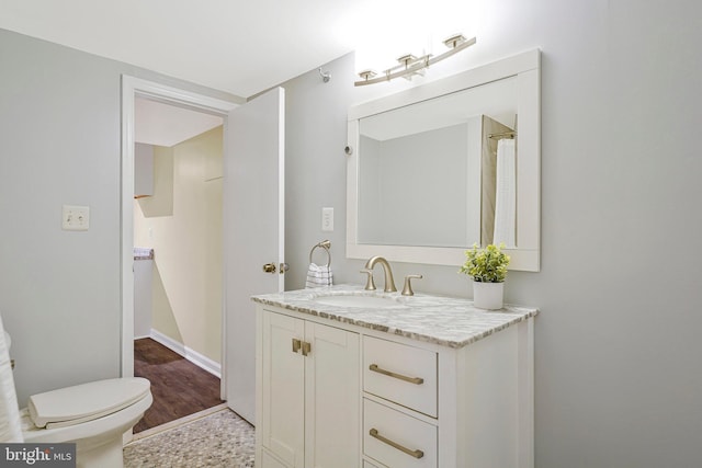 8230 Citadel Pl, Vienna, VA 22180 - bathroom with vanity, toilet, and baseboards