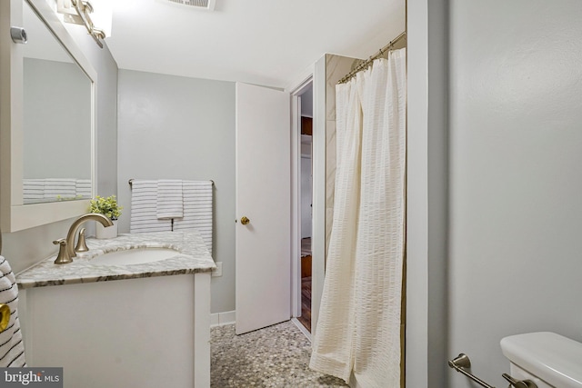 8230 Citadel Pl, Vienna, VA 22180 - bathroom featuring toilet, vanity, baseboards, and a shower with curtain