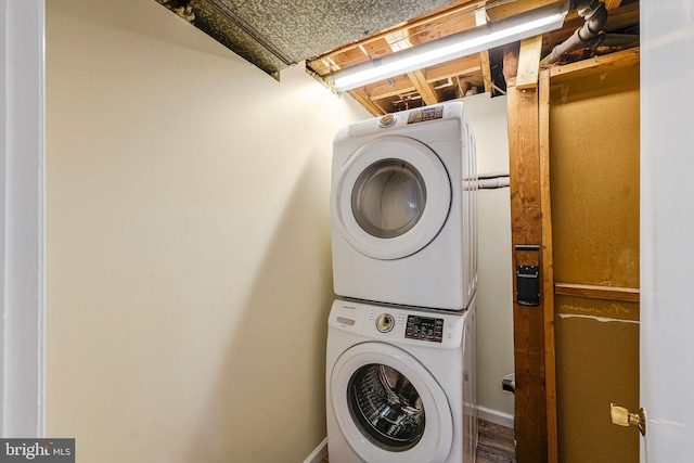 8230 Citadel Pl, Vienna, VA 22180 - laundry room featuring stacked washer / drying machine and wood finished floors