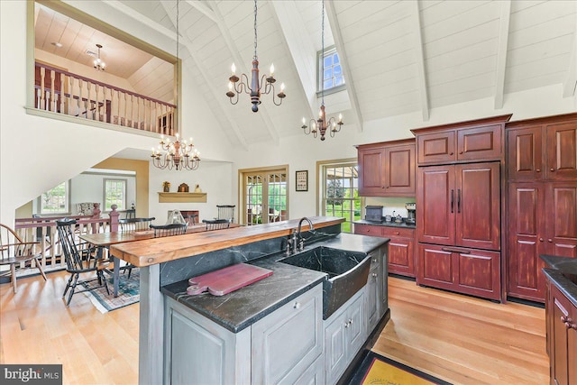 103 Orchard Hill Ln, Elverson, PA 19520 - kitchen featuring paneled refrigerator, a sink, light wood-style floors, a chandelier, and high vaulted ceiling