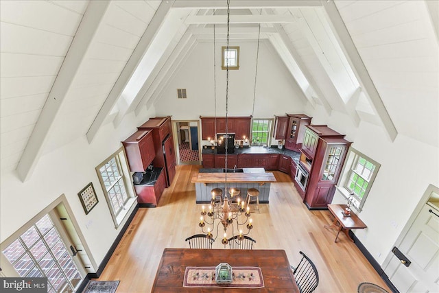 103 Orchard Hill Ln, Elverson, PA 19520 - living room with high vaulted ceiling, beamed ceiling, light wood-type flooring, healthy amount of natural light, and a chandelier