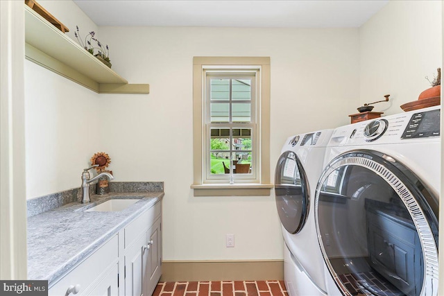 103 Orchard Hill Ln, Elverson, PA 19520 - laundry room featuring washing machine and dryer, cabinet space, brick patterned flooring, and baseboards