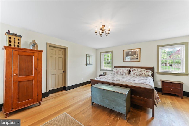 103 Orchard Hill Ln, Elverson, PA 19520 - bedroom featuring light wood-style flooring, a chandelier, and baseboards