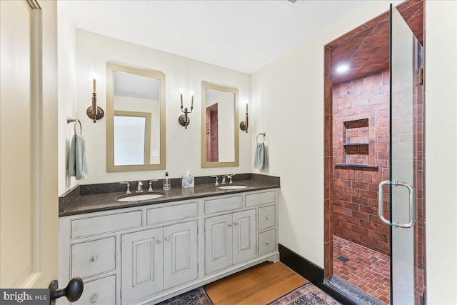 103 Orchard Hill Ln, Elverson, PA 19520 - bathroom featuring double vanity, a stall shower, and wood finished floors