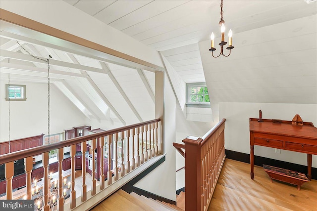 103 Orchard Hill Ln, Elverson, PA 19520 - hallway featuring an upstairs landing, a chandelier, healthy amount of natural light, and wood finished floors
