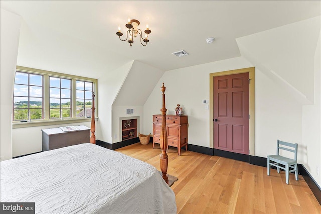 103 Orchard Hill Ln, Elverson, PA 19520 - bedroom with light wood-style floors, a chandelier, vaulted ceiling, and baseboards