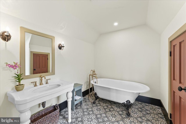 103 Orchard Hill Ln, Elverson, PA 19520 - full bath with a sink, a freestanding tub, baseboards, and lofted ceiling