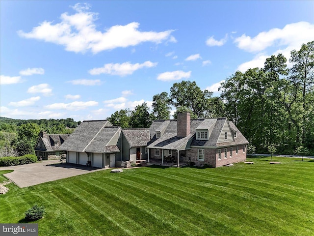 103 Orchard Hill Ln, Elverson, PA 19520 - shingle-style home with an attached garage, a chimney, asphalt driveway, and a front yard