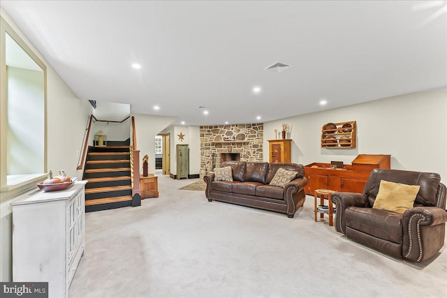 103 Orchard Hill Ln, Elverson, PA 19520 - living area featuring light colored carpet, recessed lighting, stairway, and a stone fireplace