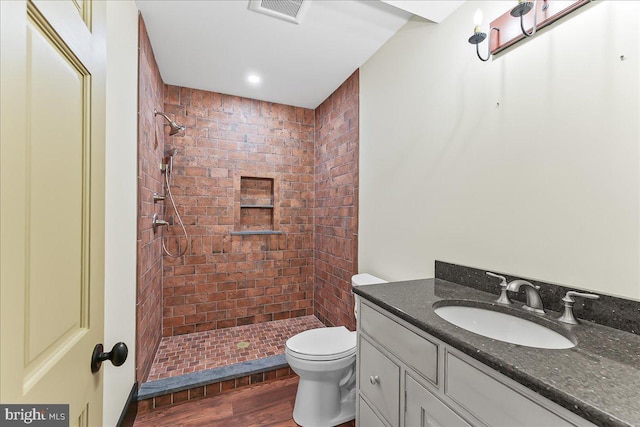 103 Orchard Hill Ln, Elverson, PA 19520 - full bathroom featuring toilet, a shower stall, vanity, and wood finished floors