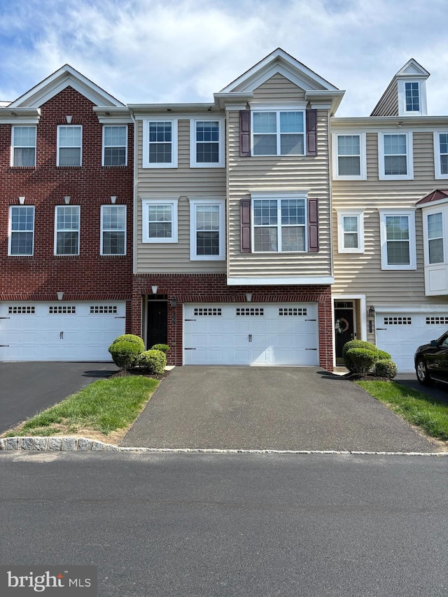 19 Rosy Ridge Ct, Telford, PA 18969 - view of property featuring driveway, a garage, and brick siding