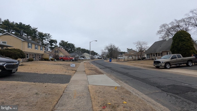 71 Shawmont Ln, Willingboro, NJ 08046 - view of asphalt street with a residential view, sidewalks, and street lights