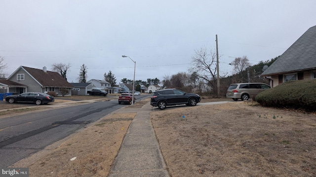 71 Shawmont Ln, Willingboro, NJ 08046 - view of asphalt street featuring sidewalks, street lights, and a residential view
