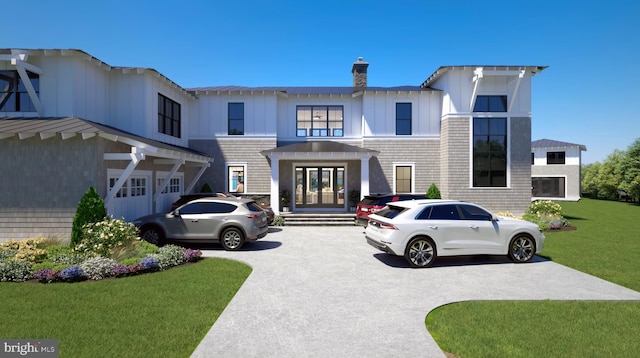 25826 Orchard Ter, Royal Oak, MD 21662 - view of front facade with a front lawn, french doors, a chimney, and board and batten siding