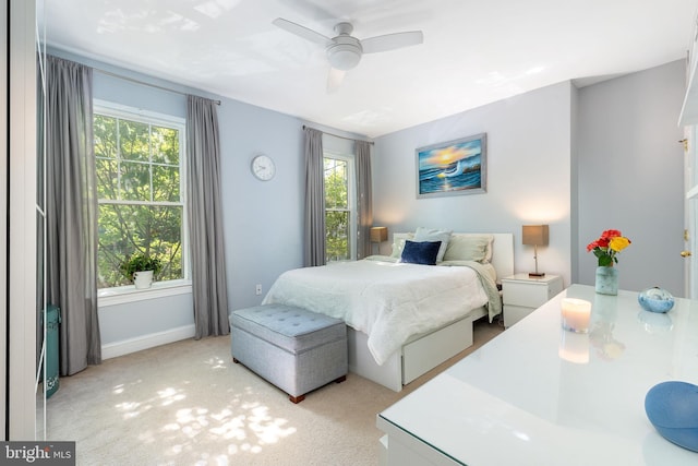 1238 N Mascher St, Philadelphia, PA 19122 - bedroom with multiple windows, light colored carpet, a ceiling fan, and baseboards