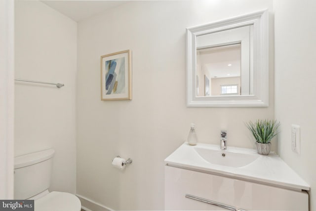 1214 Queen St NE Unit 2, Washington, DC 20002 - half bathroom featuring toilet, vanity, and baseboards
