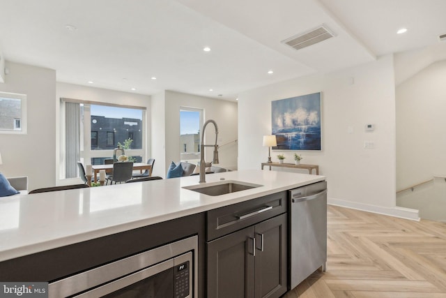 1214 Queen St NE Unit 2, Washington, DC 20002 - kitchen with a sink, appliances with stainless steel finishes, light countertops, recessed lighting, and open floor plan