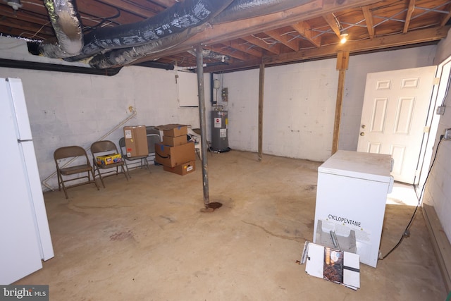 1675 Highland Ter, Saint Leonard, MD 20685 - unfinished basement with electric water heater, freestanding refrigerator, white fridge, and concrete block wall