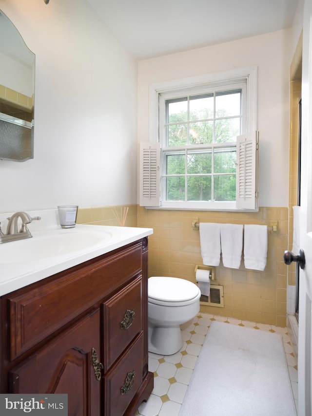 5 Salem Way, Malvern, PA 19355 - bathroom with tile walls, vanity, toilet, wainscoting, and an enclosed shower